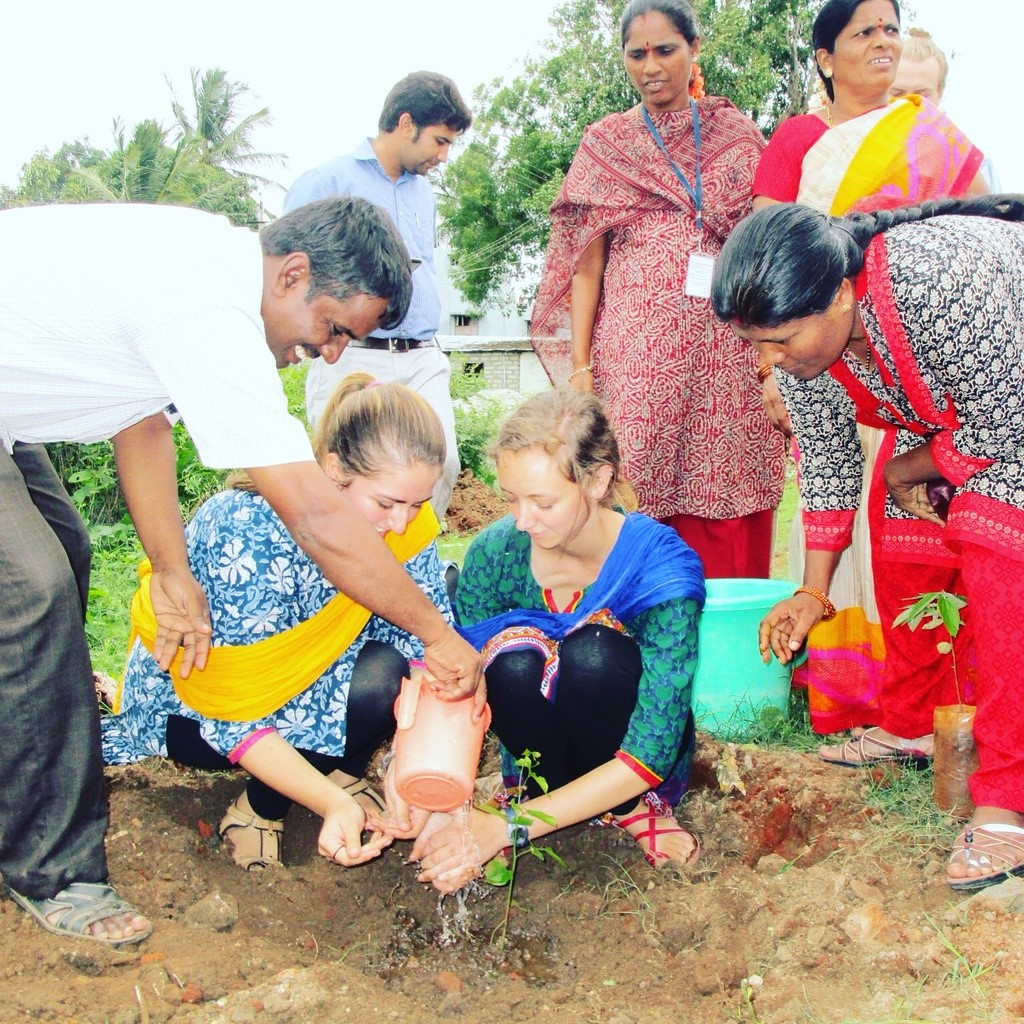 Picture of Delaney Sillman helping plant tree in Mysuru, India in summer 2016
